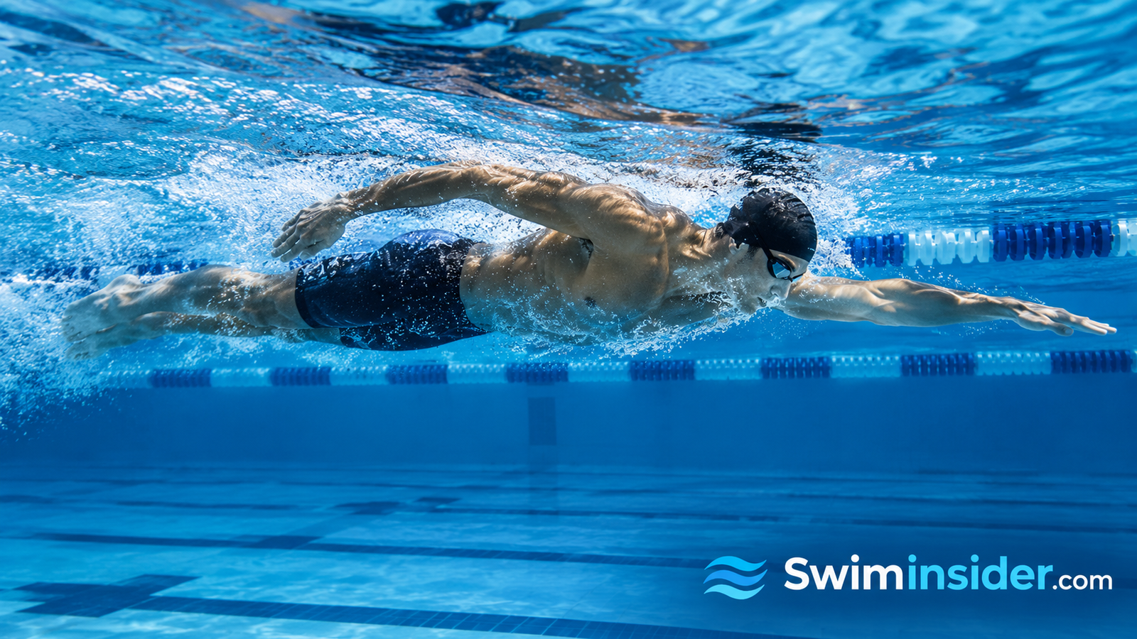 Swimmer powering through freestyle with a long, streamlined body line